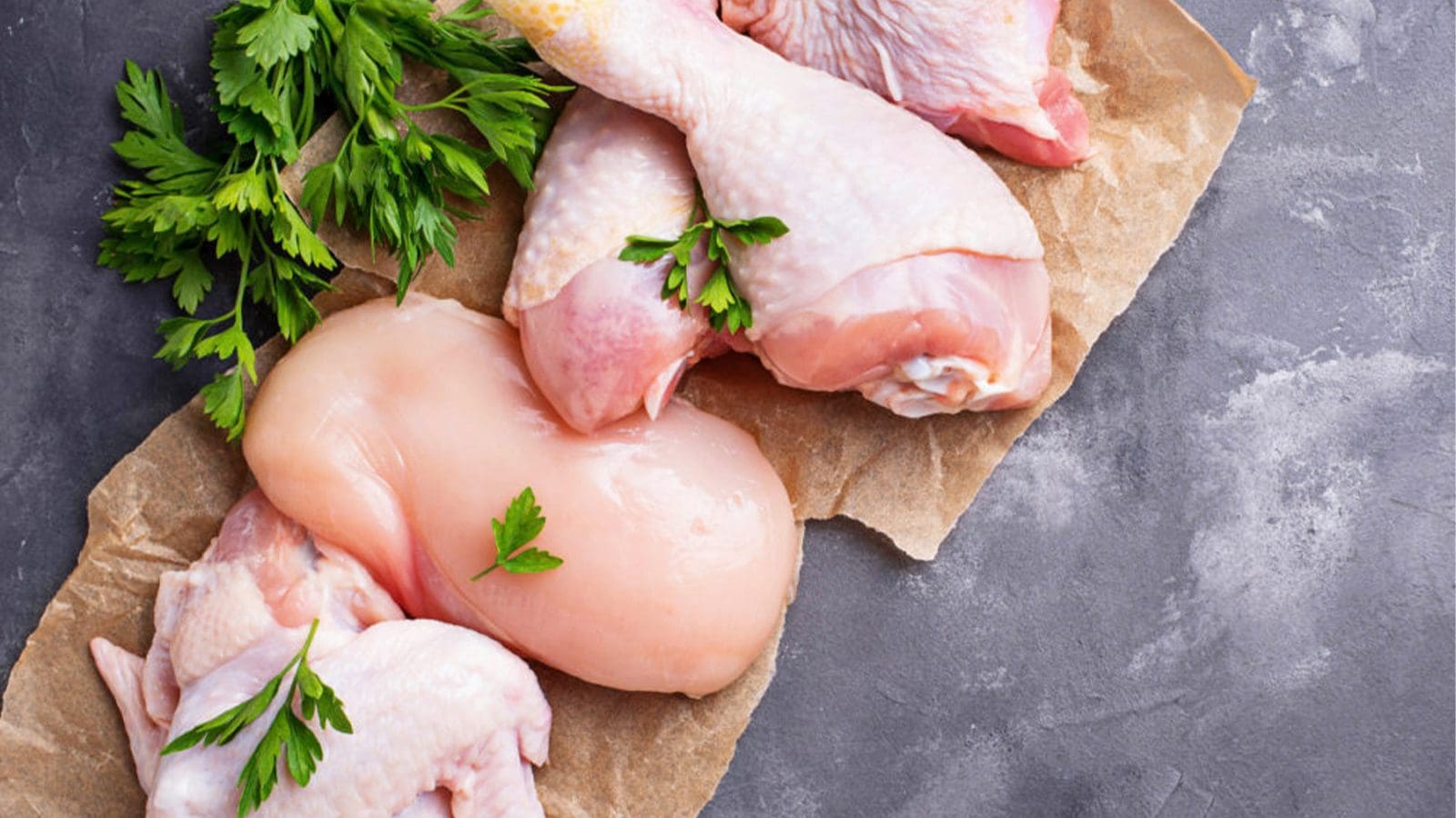 Raw chicken on cutting board